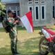 Babinsa Desa Koto Pait Beringin Ajak Warga Kibarkan Merah Putih, Sambut HUT RI ke-80